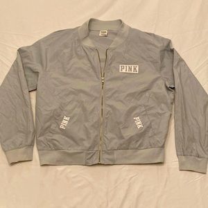 Lightly used silver windbreaker jacket. PINK by Victoria’s Secret.  Size M